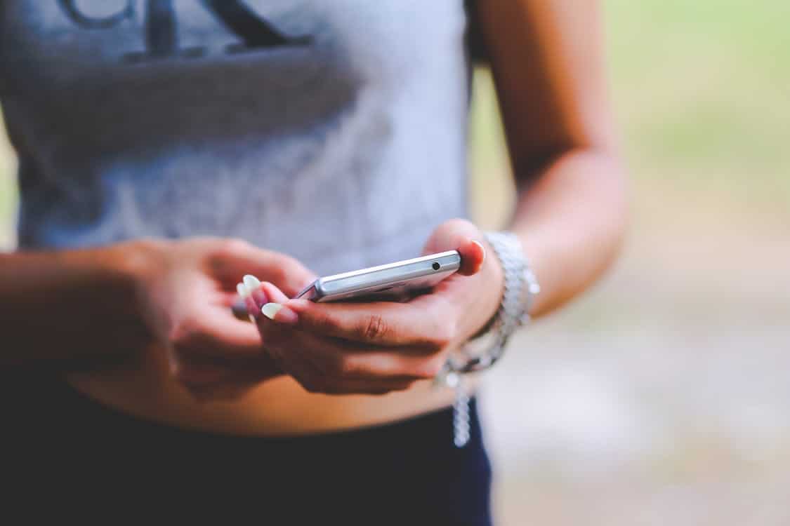 holding-cell-phone-in-hand